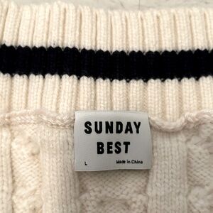 sweater vest from aritzia - new - selling because it is too large for me